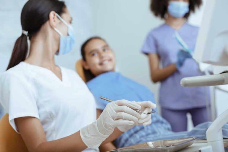 Dentist preparing for a comfortable and child-friendly dental examination.