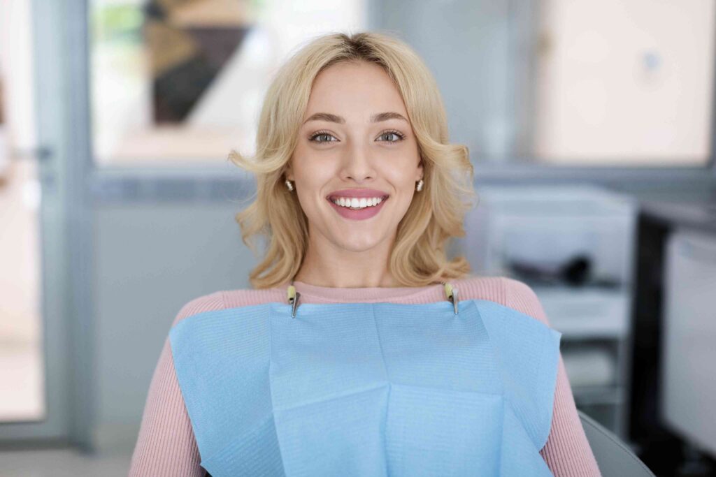 Smiling patient after a teeth whitening treatment.